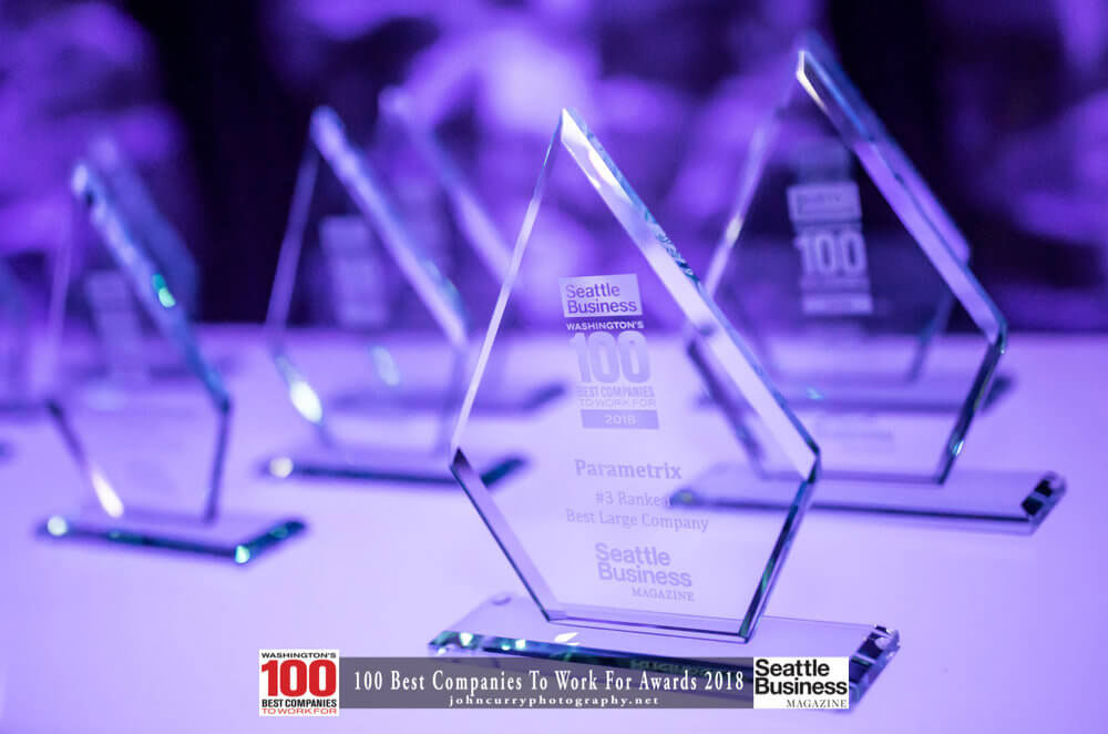 Seattle-Best-Companies-To-Work-For-Affirma awards on a table.