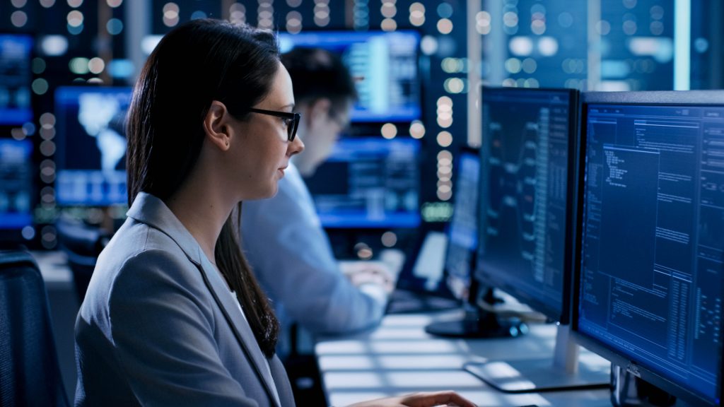 woman-sitting-at-desktop-cybersecurity-1024x576