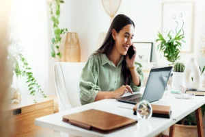 A woman working on her laptop, using ai in marketing automation to enhance her marketing strategies.