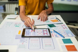 A person working on a ui/ux design brief for a client.