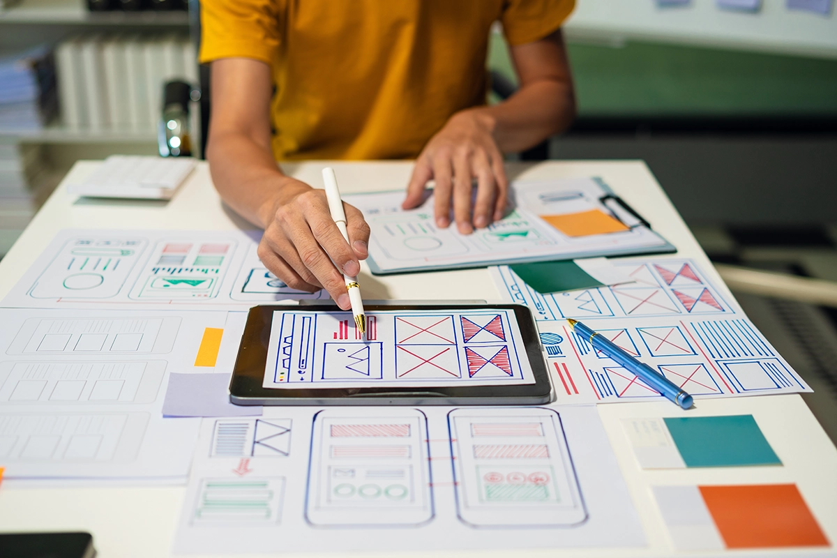 A person working on a ui/ux design brief for a client.