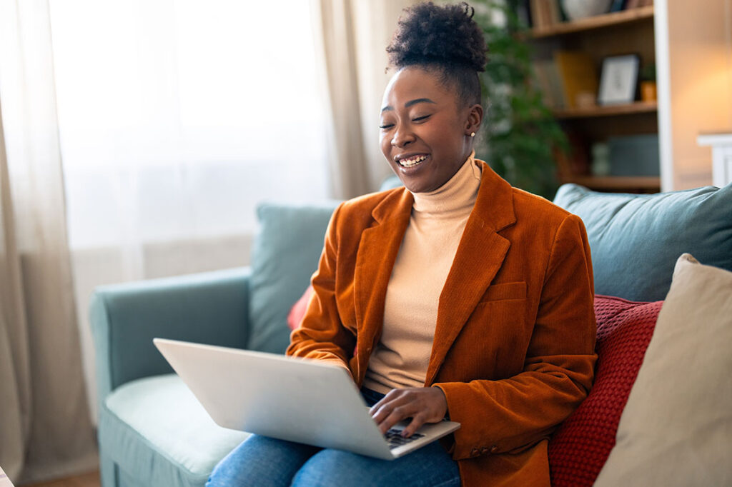 A content marketer looking up content marketing trends on her laptop.
